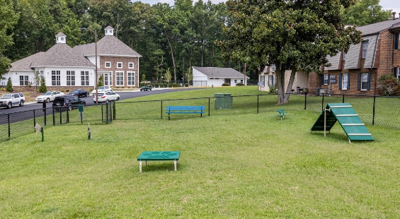 dog park in grassy area at The Residences at Brookside